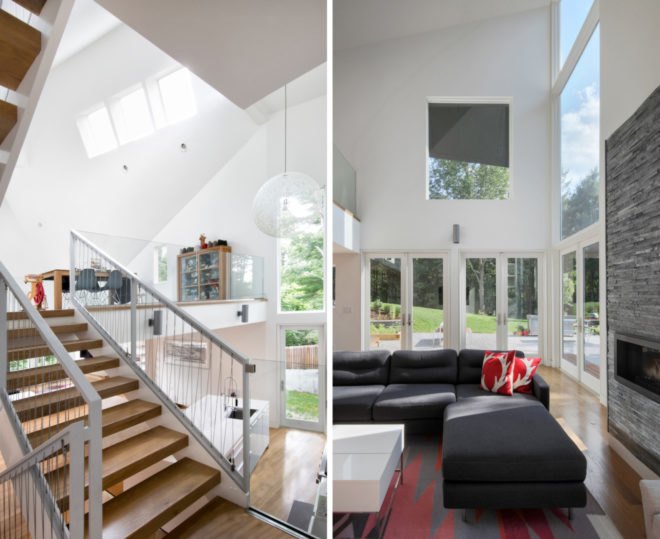 living space with angular ceilings and multiple windows