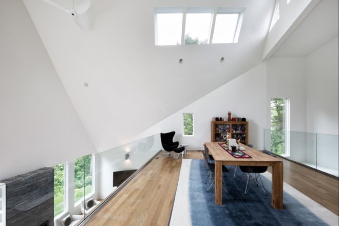 interior living space with white walls and large dining table