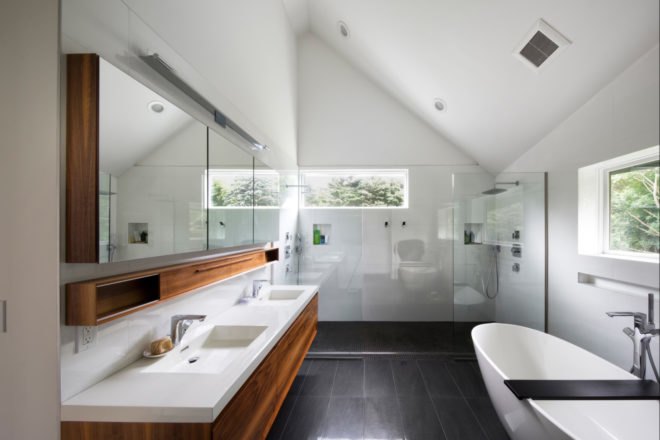 large white and gray bathroom with angular ceilings
