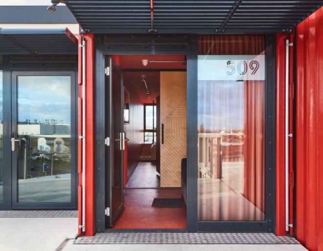 a glass door opening up to a lobby