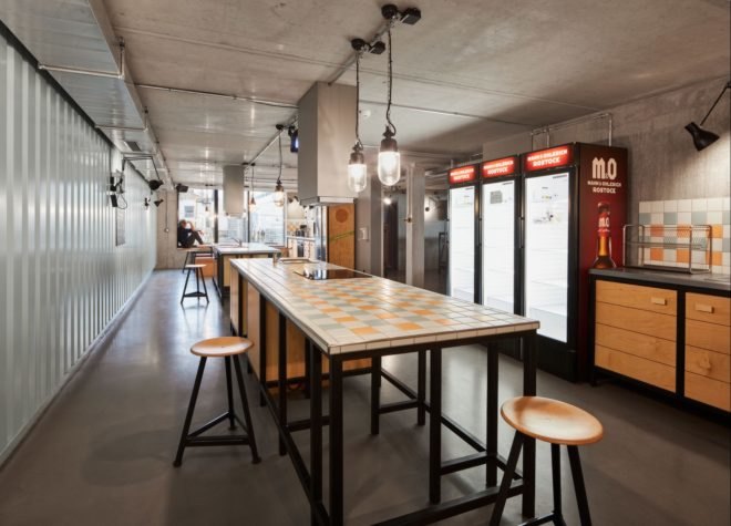 a long, high-top table with stools