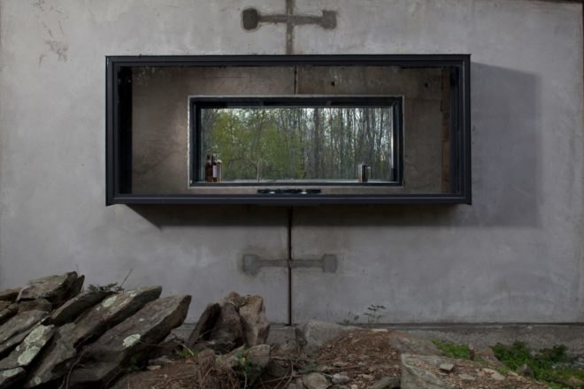 an exterior shot of home with large window