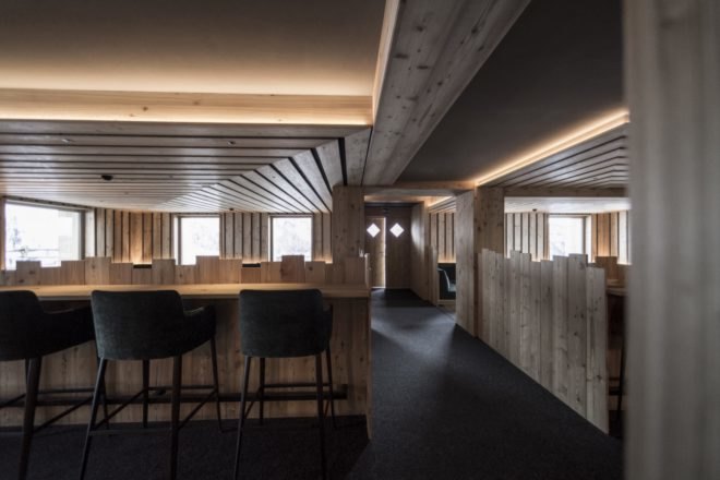 public space inside hotel with chairs and booths
