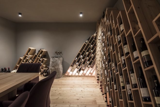 hotel wine cellar with intricate modern design storing individual bottles