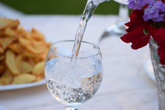 mineral water poured into a glass