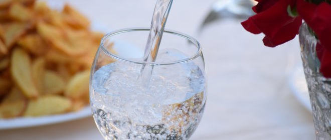 mineral water poured into a glass