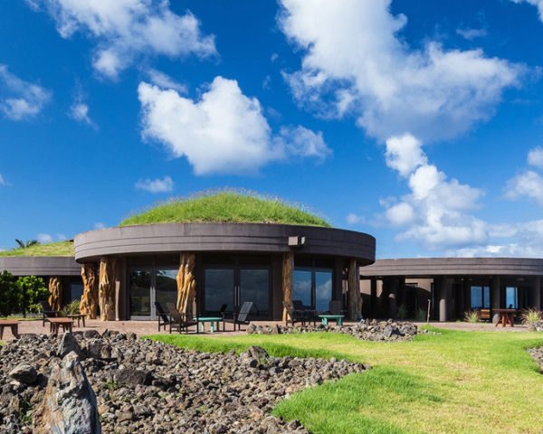 path leading to round building with green roof
