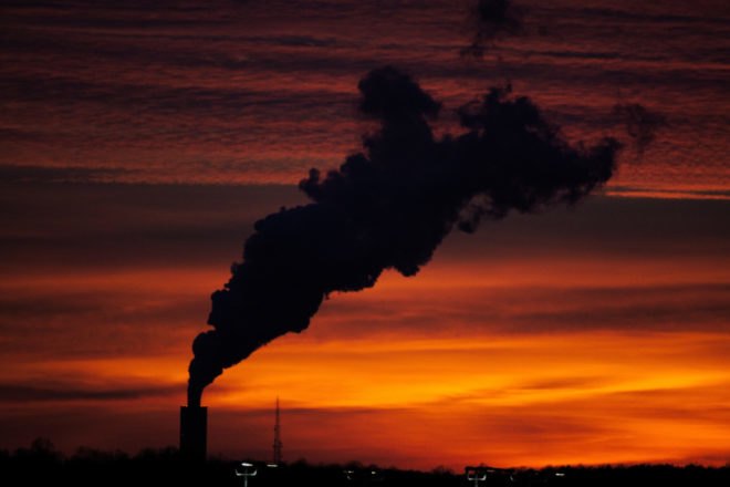 Factory smoke during sunset