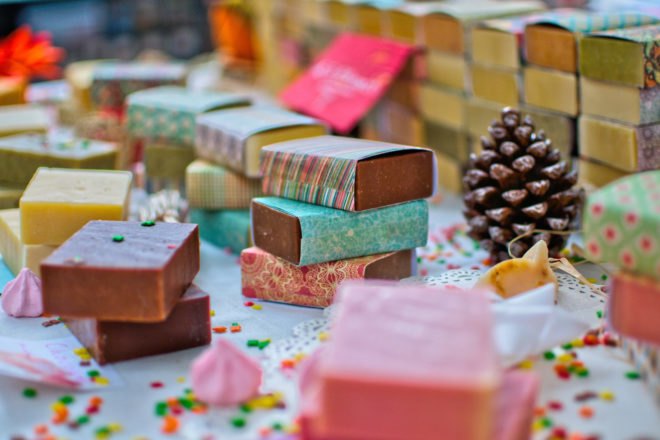 table full of colorful handmade bar soaps