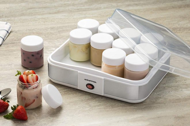 machine holding jars of homemade yogurt