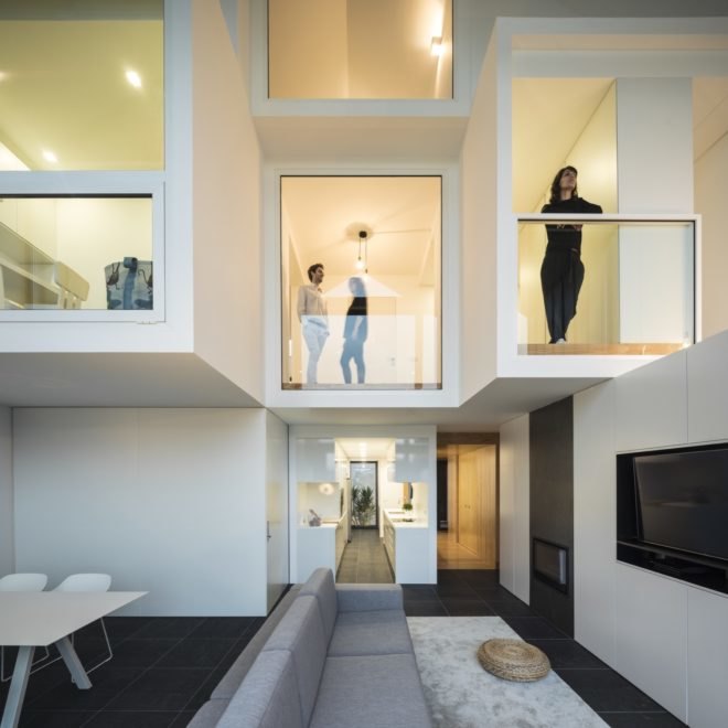 white home with several windows.