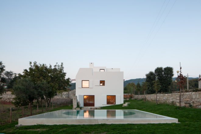 white cube home with pool