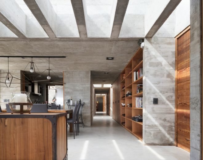 interior living space with concrete walls and flooring