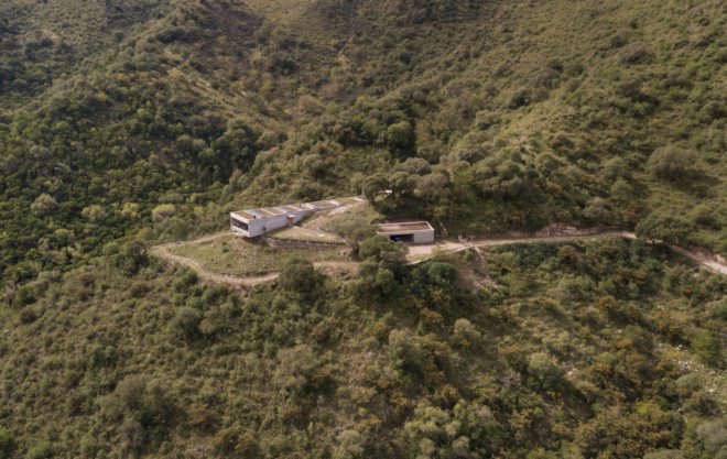 aerial view of rectangular home with green roof