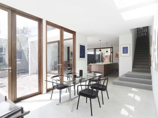 dining area with view of staircase leading to second floor