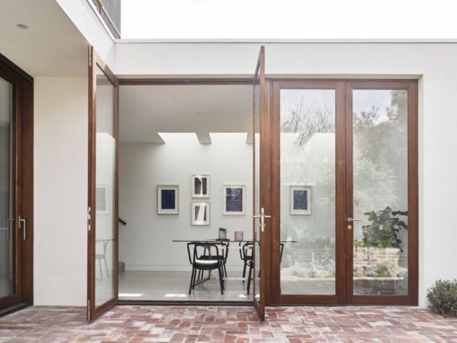 double glass doors are opened by dining area