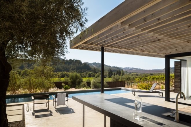 outdoor view of the poolhouse terrace by the pool