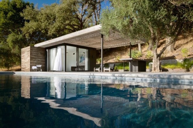 pool house surrounded by greenery