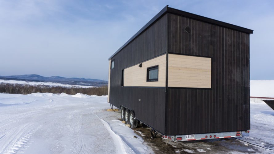 two-tone tiny home on wheels