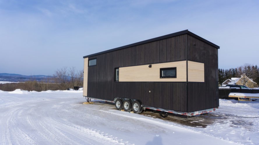 two-tone tiny home on wheels