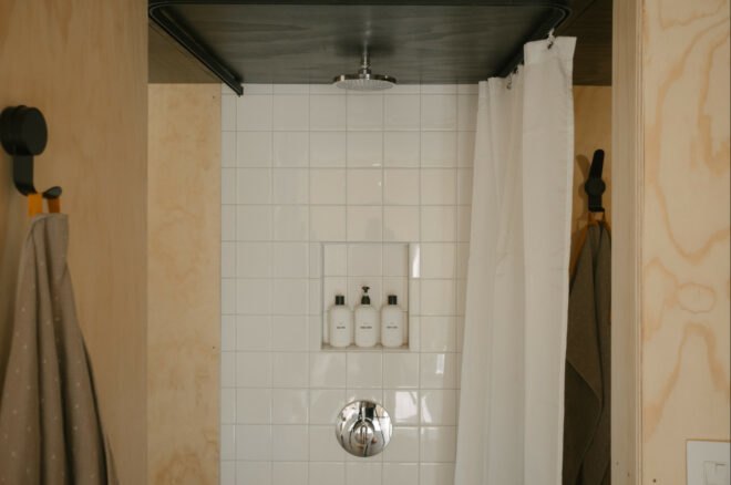 white tiled shower stall