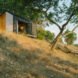 Black tiny cabin on hilltop