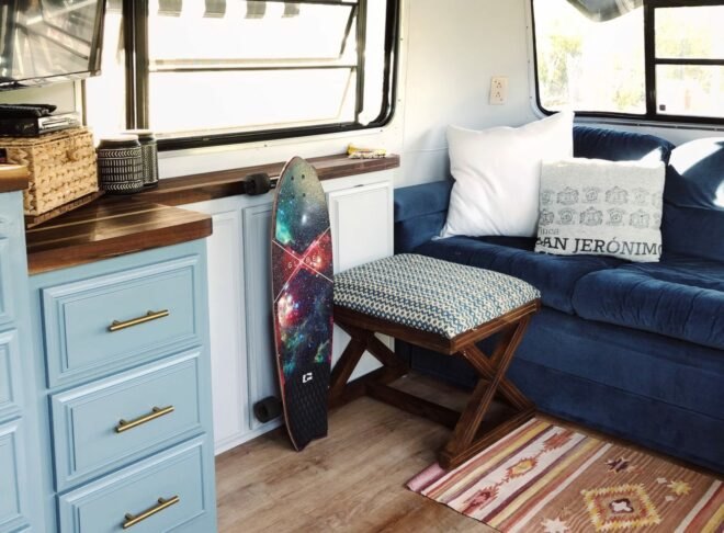 blue couch and small foot stool