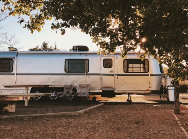 long silver RV with plenty of windows