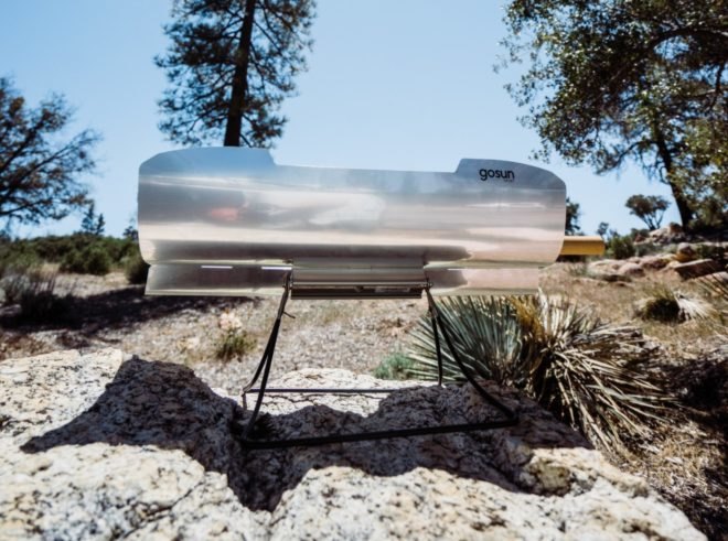 solar cooker on a rocky landscape