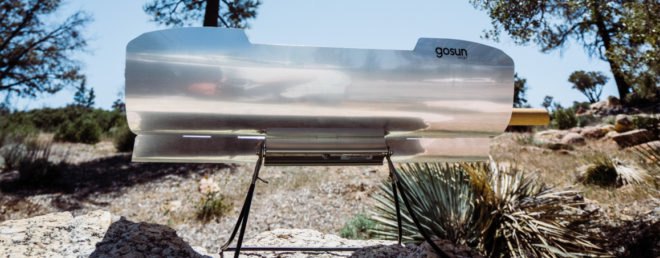solar cooker on a rocky landscape