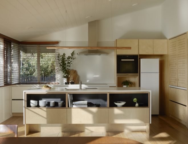 small kitchen area with appliances and wood cabinets