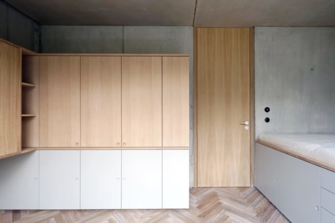 gray room with wood storage cabinets