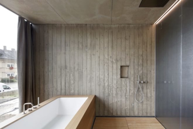 bathroom with freestanding tub built into wood frame
