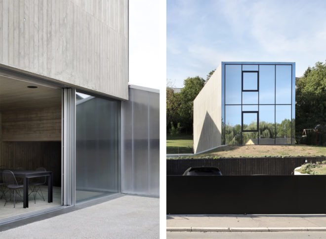On the left, glass door opening onto a patio. On the right, gray home with mirrored wall.