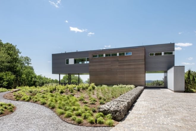 elevated gray and wood home