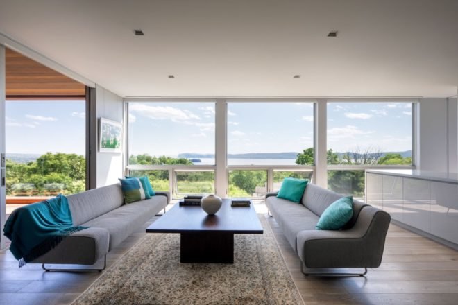 living room with gray sofas and large windows