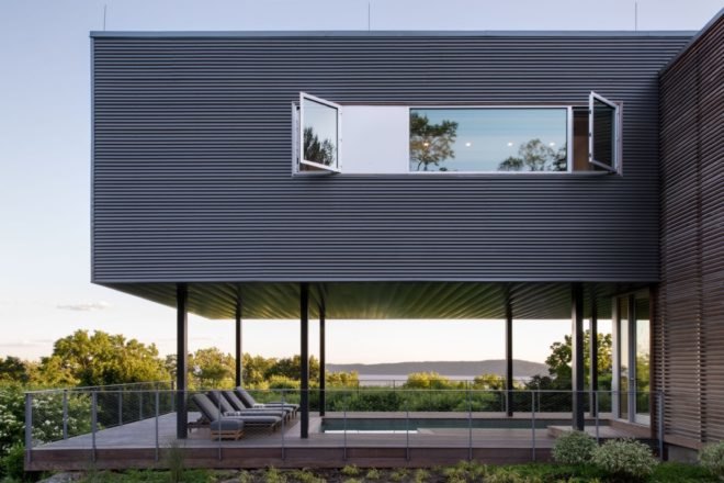 elevated gray home overlooking Hudson River