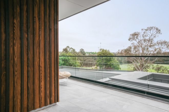 small white chair on covered outdoor patio