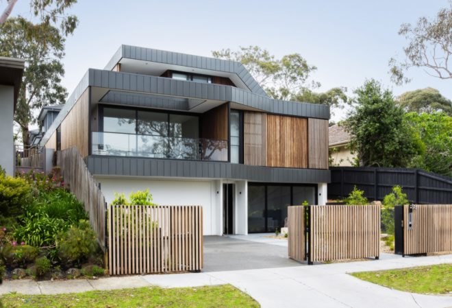 black and timber home with many windows
