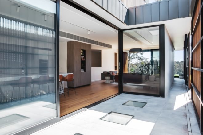 kitchen opening to patio through sliding glass doors