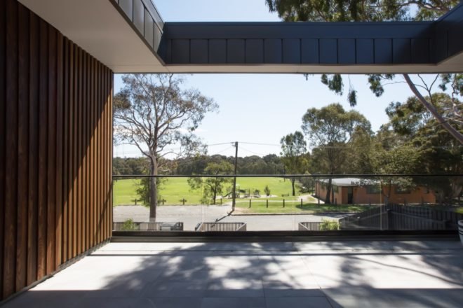 covered patio with views of green hills