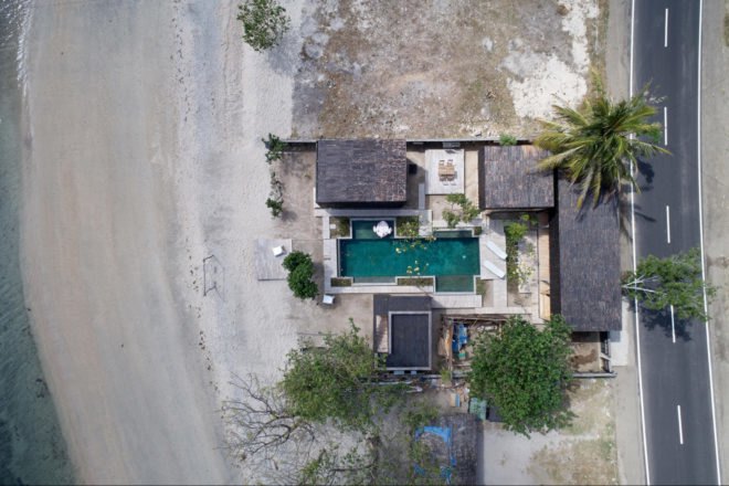 aerial image of a beachside resort with pool