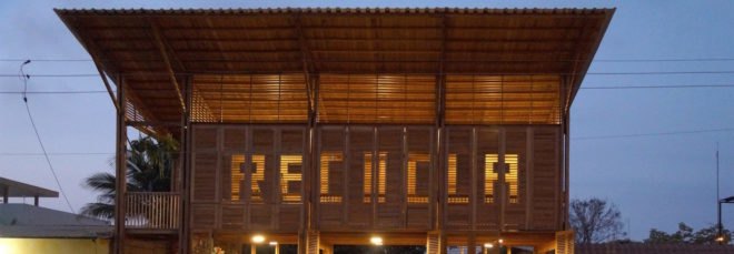 wood building with word "RECICLA" on the front