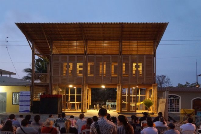 wood building with word "RECICLA" on the front