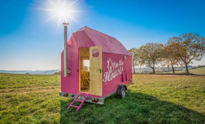 A tiny pink home on wheels