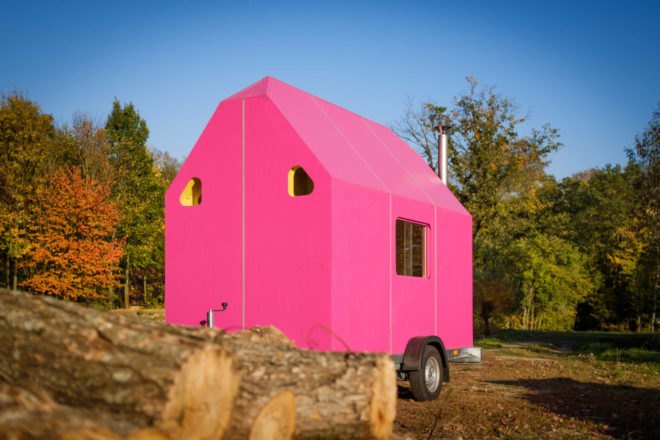A tiny pink home on wheels