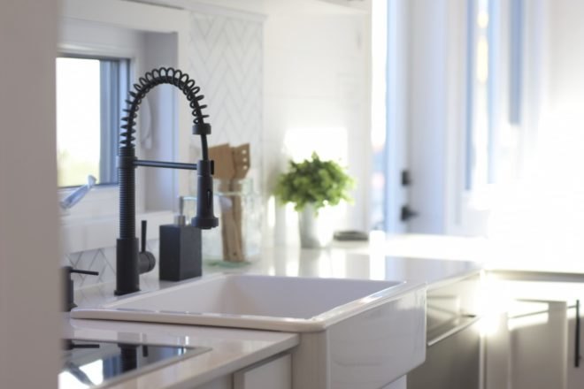 white farmhouse sink in kitchen