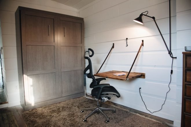 room with small desk and chair