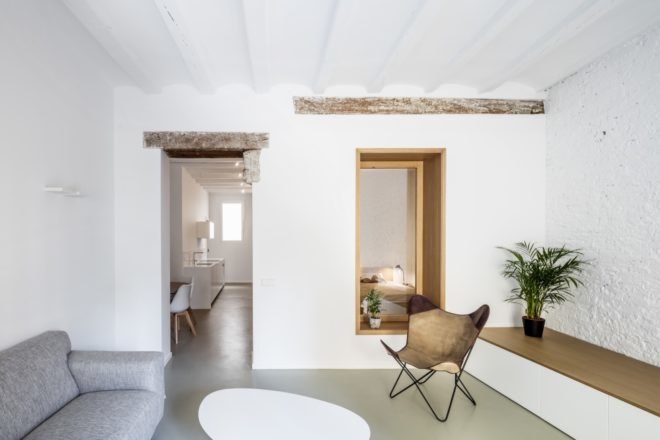 minimalist living area with white walls