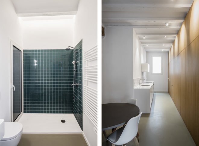 bathroom with green tile and kitchen area